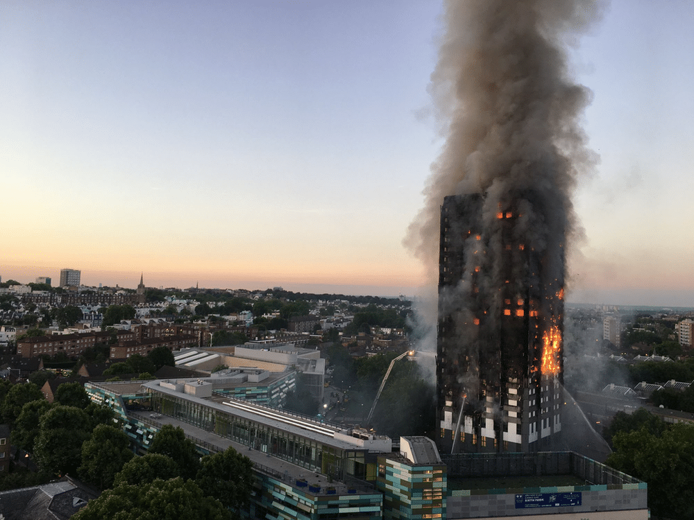 Flames engulfing Grenfell Tower in London during the tragic fire on June 14, 2017. Thick smoke rises from the building as emergency services respond to the devastating blaze.