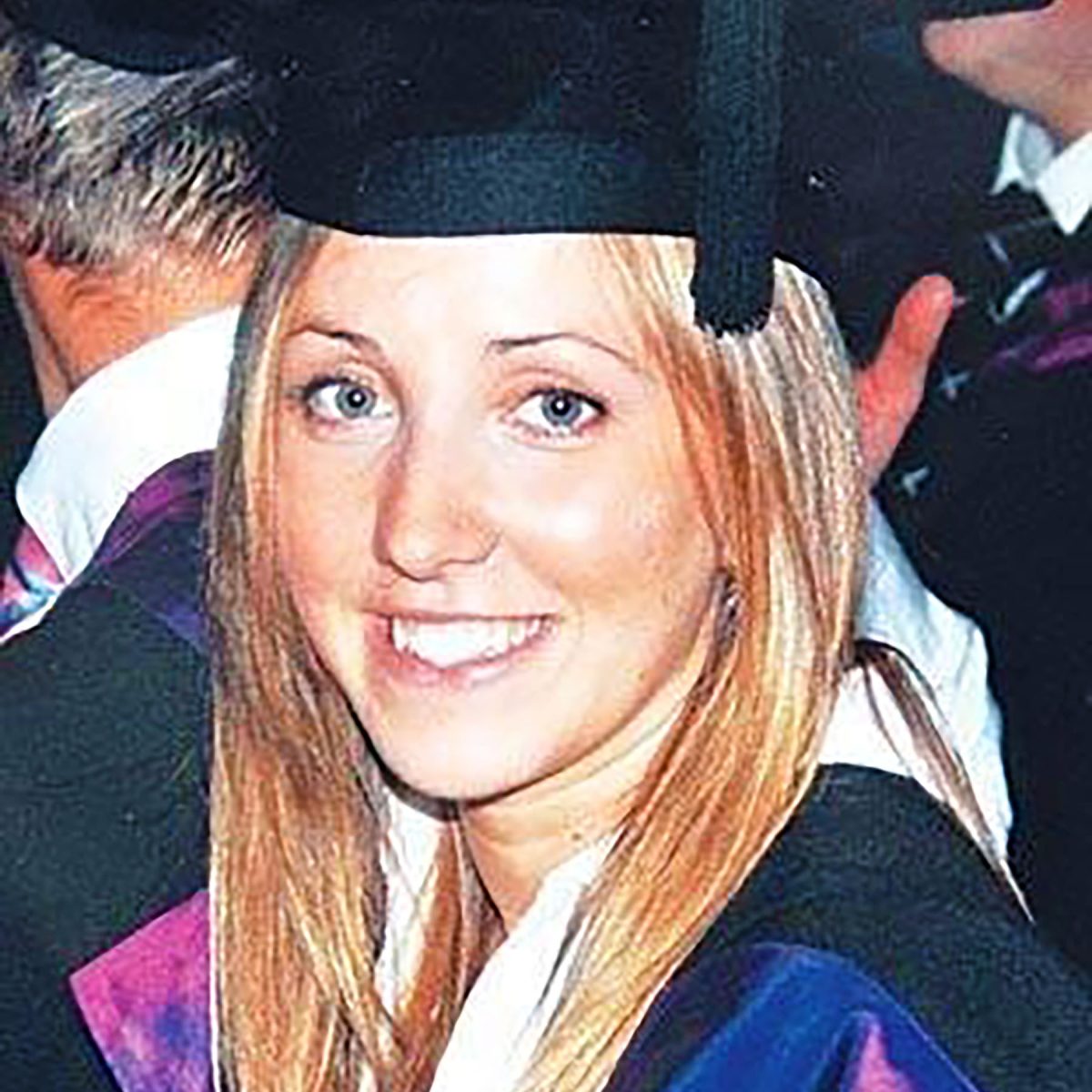 Photograph of Emily Jordan wearing a graduation cap.